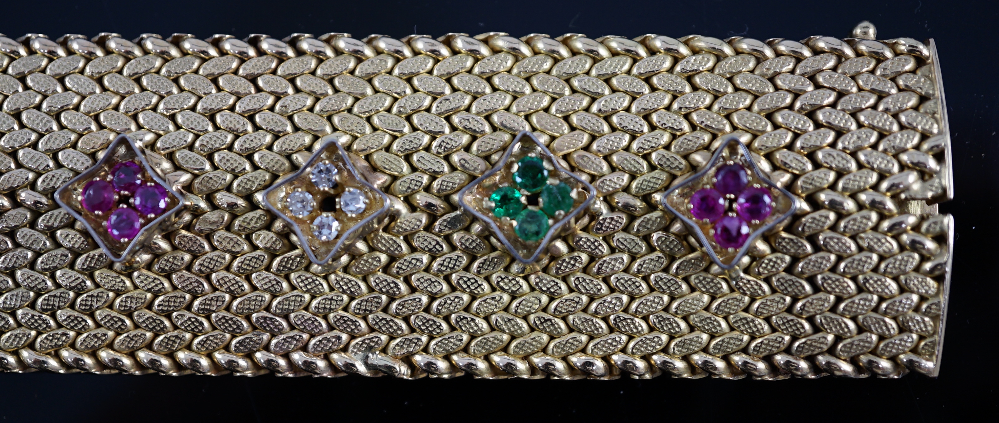 A mid 20th century Italian textured 18ct gold, ruby, emerald and diamond cluster set bracelet